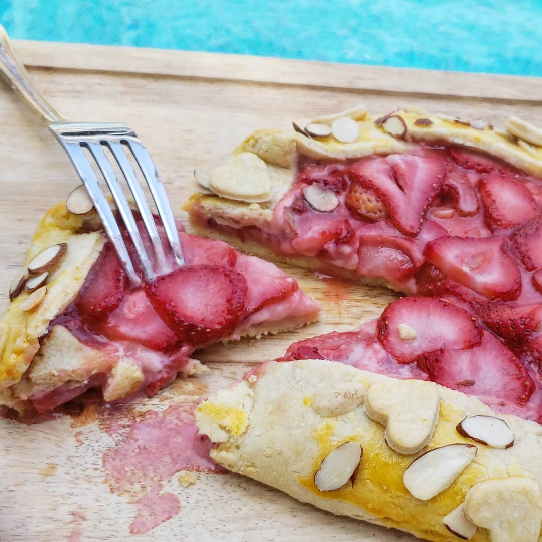 Piece of a strawberry pie, on a fork